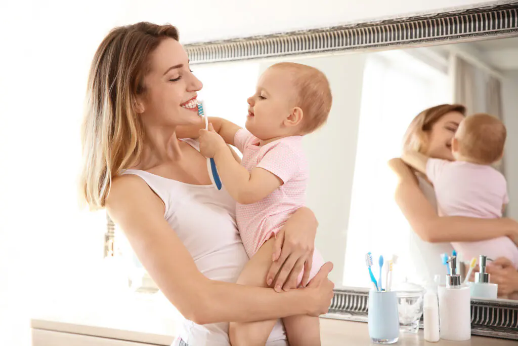Mommy and baby brushing teeth